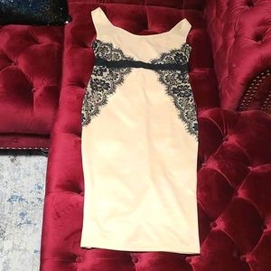 Nude dress with black lace overlay on both sides